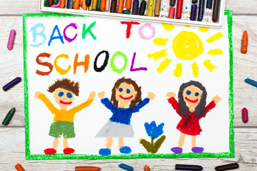 Obraz na płótnie Canvas Photo of colorful drawing: Word BACK TO SCHOOL and happy children. First day at school.