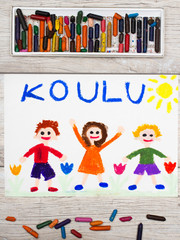 Photo of  colorful drawing: Finnish word SCHOOL and happy children. First day at school.