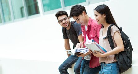 Asian students group are reading books. at the university library