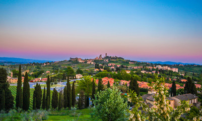 San Gimignano town skyline and medieval towers sunset. Tuscany, Italy, Europe.