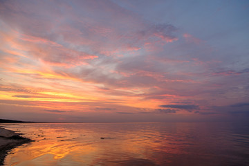 Fototapeta na wymiar Colorful sunset on beach