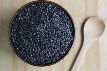 Black rice in a wooden bowl.