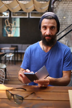 Man with a phone in cafe