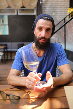 Bearded guy with glass of wine