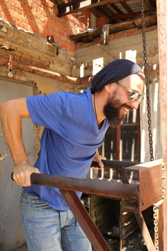 Bearded man on parallel bars