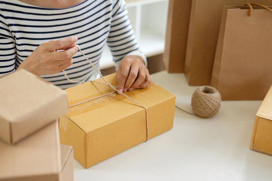  Teenager owner  work at home for online shopping preparing package the product with office