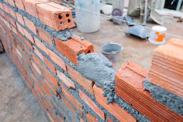 Construction of red brick walls for building structures