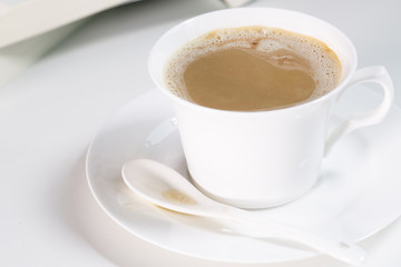 Mocha coffee cup and one book.