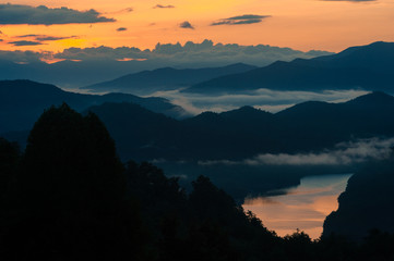 Orange sunrise and mist near Smoky Mountains National Park, North Carolina