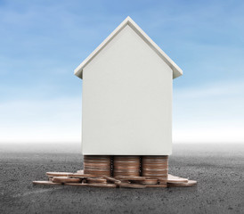 House on pile of coins,money