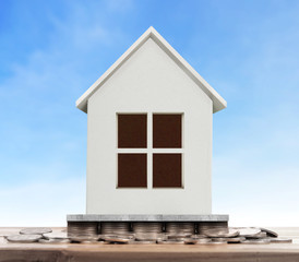 House on pile of coins,money