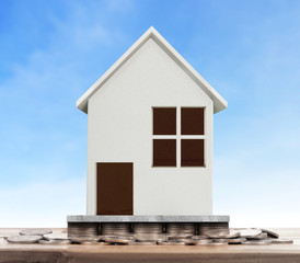 House on pile of coins,money