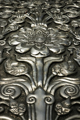  flower in metal ,hammered, chased 