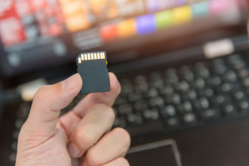 SD card with laptop computer background