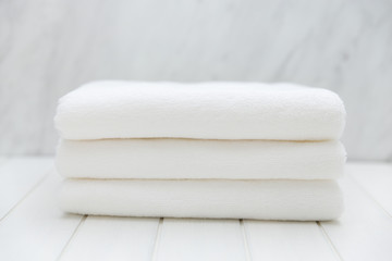 Fototapeta na wymiar All White Spa and Bath Image - Stacked Towels