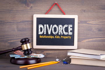 Divorce concept. Relationships Children Property. Chalkboard on a wooden background.