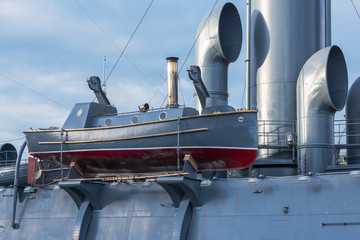 Boat with steam engine aboard the old military cruiser