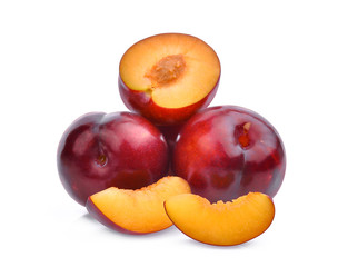 whole and half with slice of red cherry plums isolated on white background