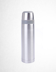 Thermo or Thermo flask from stainless stee on background.