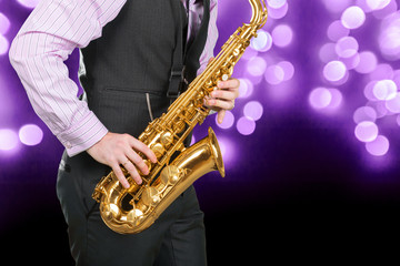 Fototapeta na wymiar Jazz saxophone player in performance on the stage.