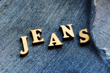 Wooden letters and jeans
