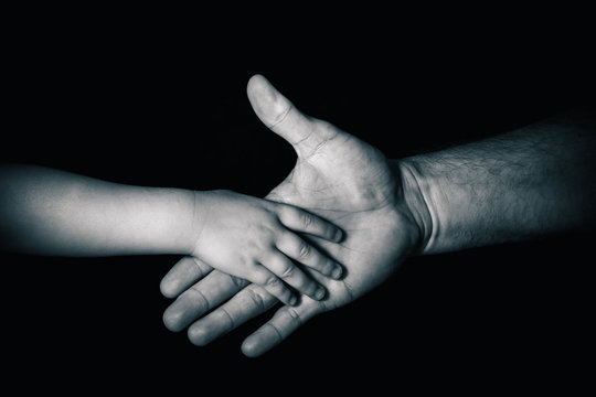 Hand in hand. Hands of father and his child