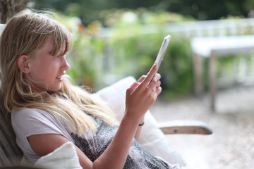 teenage girl on terrace, reading from ipad, children, kid, child
