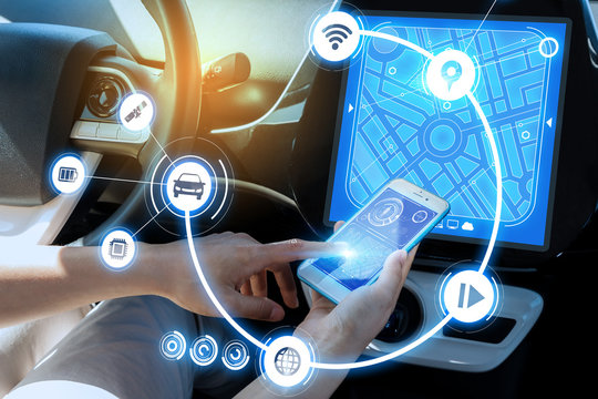wireless communication between smart phone and car instrument panel. autonomous car. car electronics concept.