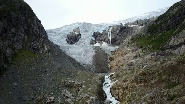 Blue ice glacier front. Buer glacier, Norway from air view from drone