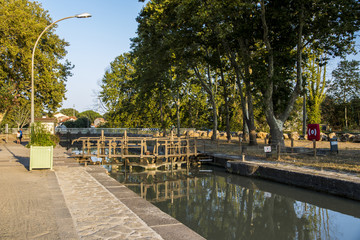 Obraz premium One of the locks in Beziers, France, that helps the Canal du Midi to cross over the river Orb. A world heritage site since 1996