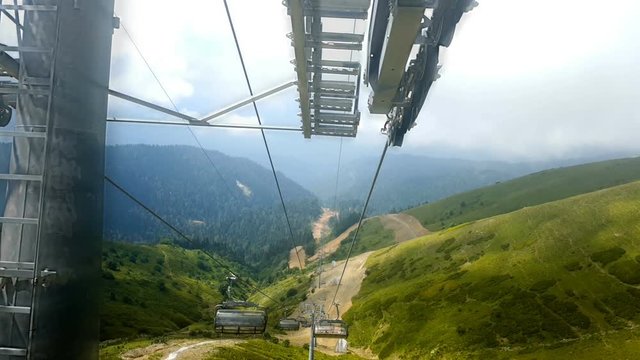Cabins of the cable car are moving down. Rosa Khutor. Russia.