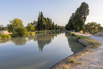 The Canal du Midi in Beziers at sunset, a long canal that connects the Atlantic Ocean with the...