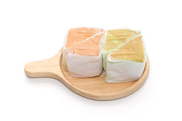 orange and pandan  Chiffon cake on wooden plate