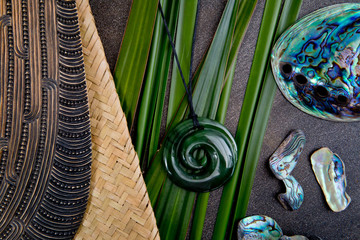 New Zealand - Maori themed objects - mere and greenstone pendant with flax leaves and abalone shells - obrazy, fototapety, plakaty