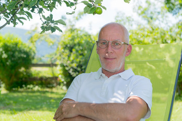 Portrait of senior man smiling in the garden