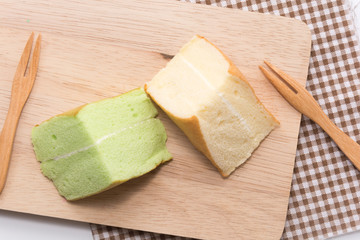 orange and pandan  Chiffon cake on wooden plate