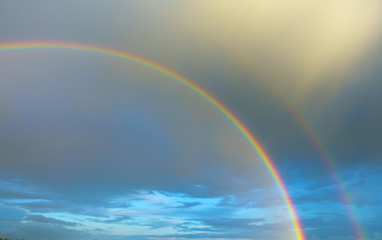 Blue sky with double rainbow