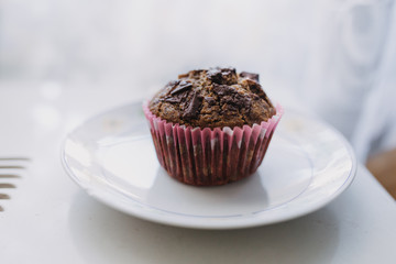 carob muffin on a white plate