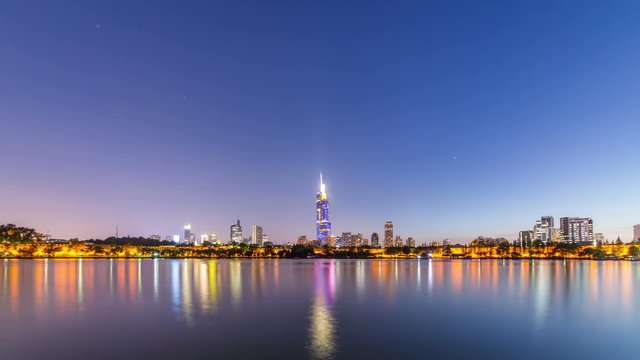 Time lapse of xuanwu lake with nanjing city skyline,from day to night landmark,china