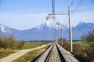 Railroad on Sorsko feld and Kamnik Savinja alps in the background.