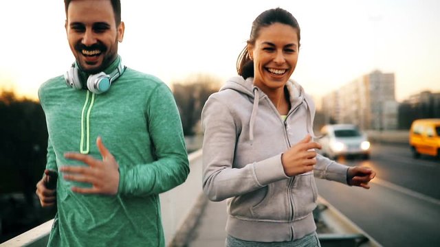 Happy friends and sports people jogging and running outdoor