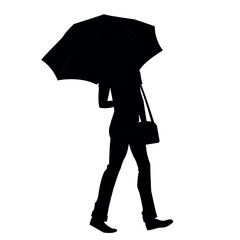 Silhouette of a man with a bag under an umbrella