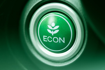 Close-up on "ECON" button in car. Conception of eco driving