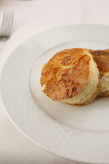 Cheese puff pastry arranged on a plate, Traditional dish in elegant setting, Selective focus with soft light