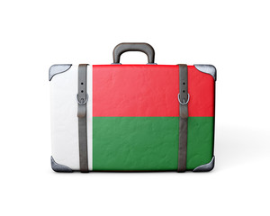 Madagascar flag on a vintage leather suitcase. 3D Rendering