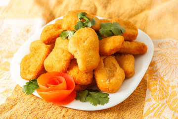 a lot of nuggets on the plate