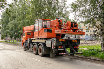 auto crane parked on the roadside