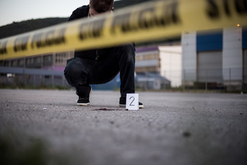 Crime scene, murder, investigation, bloody trail on asphalt, ongoing investigation, camera expert...