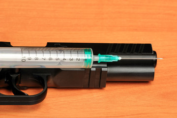 Creative Set of Medical Syringe on Wood Background