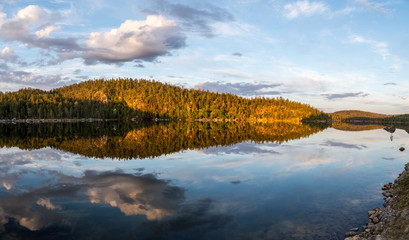 Midnight sun in Lapland.Peaceful lake view.
